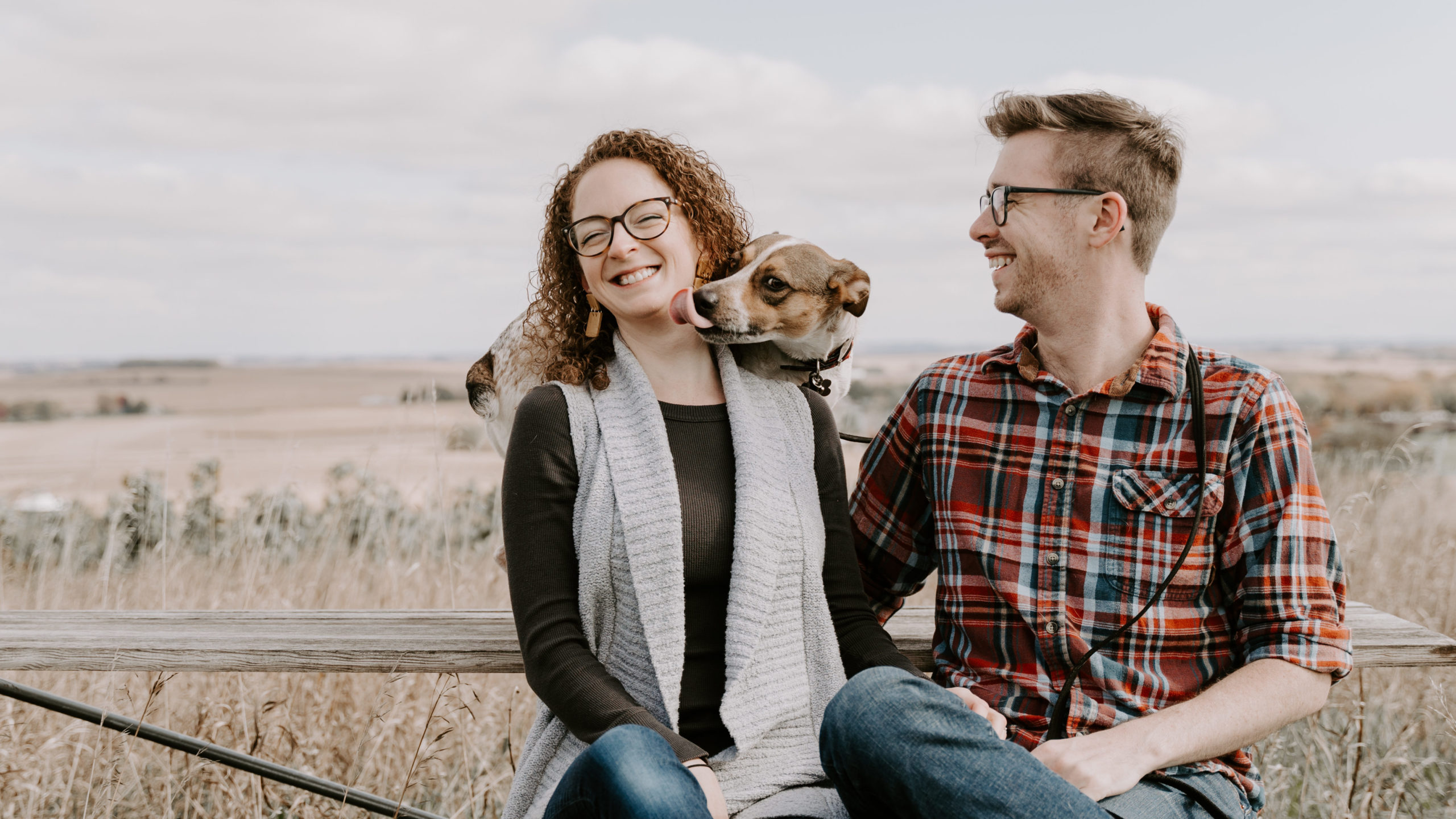woman, partner, and dog on adventure in rural America