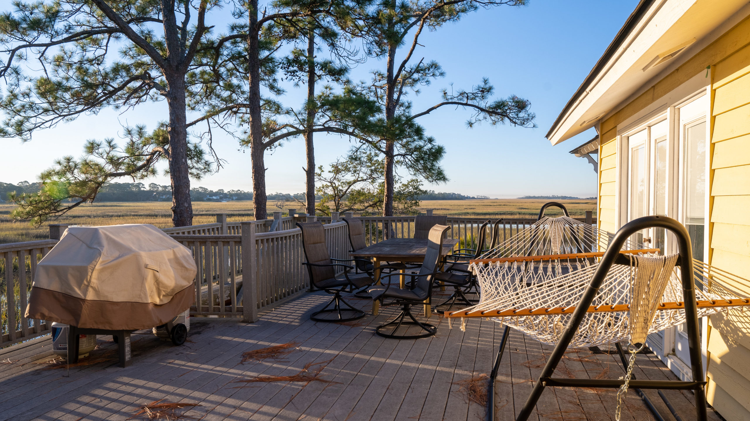 Deck with hammock and chairs overlooking wetlands in Georgia
